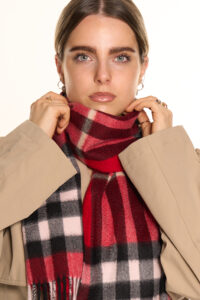 A folded tartan cashmere scarf in a signature Scottish gift box.
