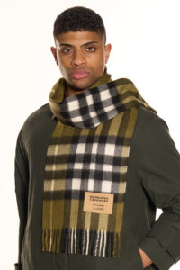 Gift-wrapped cashmere scarf next to a handwritten Valentine’s card